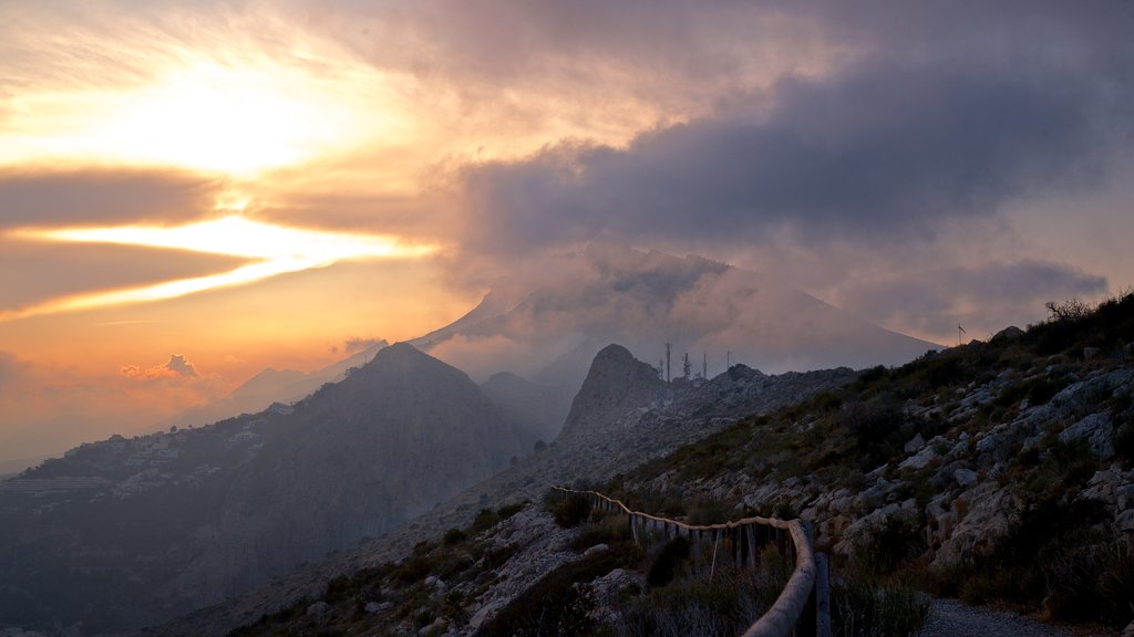 Mirador Monte Toix which includes a sunset, landscape views and mountains