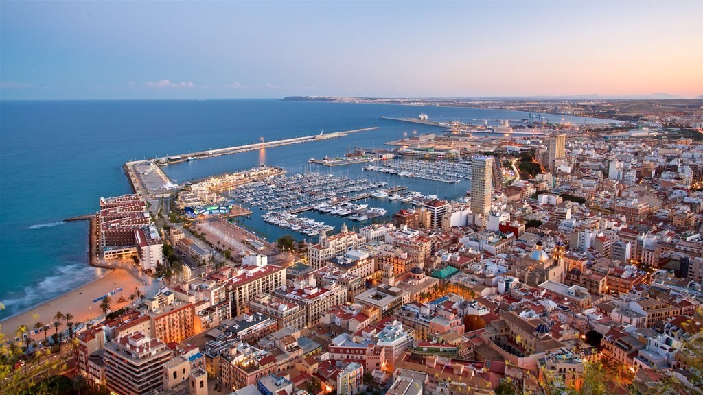 Spain which includes landscape views, a sunset and a coastal town