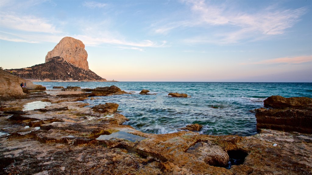 Banos de la Reina Archaelogical Site showing a sunset, rugged coastline and general coastal views