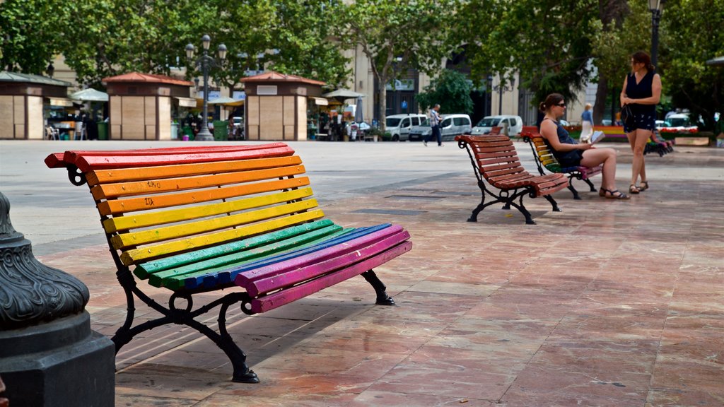 Plaza del Ayuntamiento showing a square or plaza and outdoor art