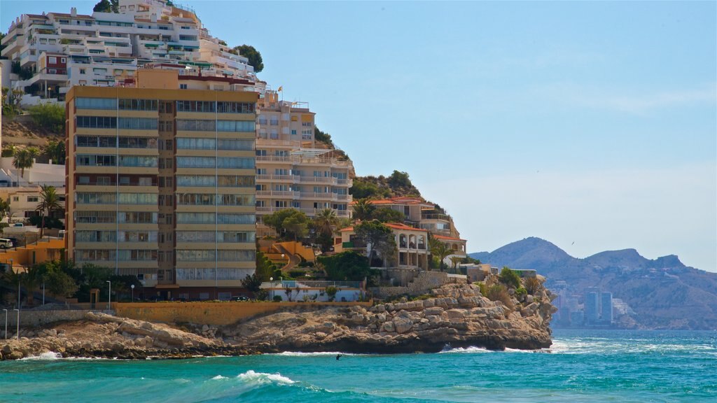 La Cala Beach showing a coastal town, rugged coastline and general coastal views