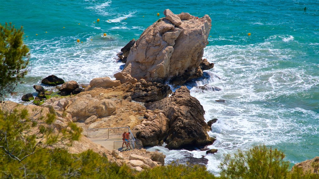 La Cala Beach which includes general coastal views and rocky coastline