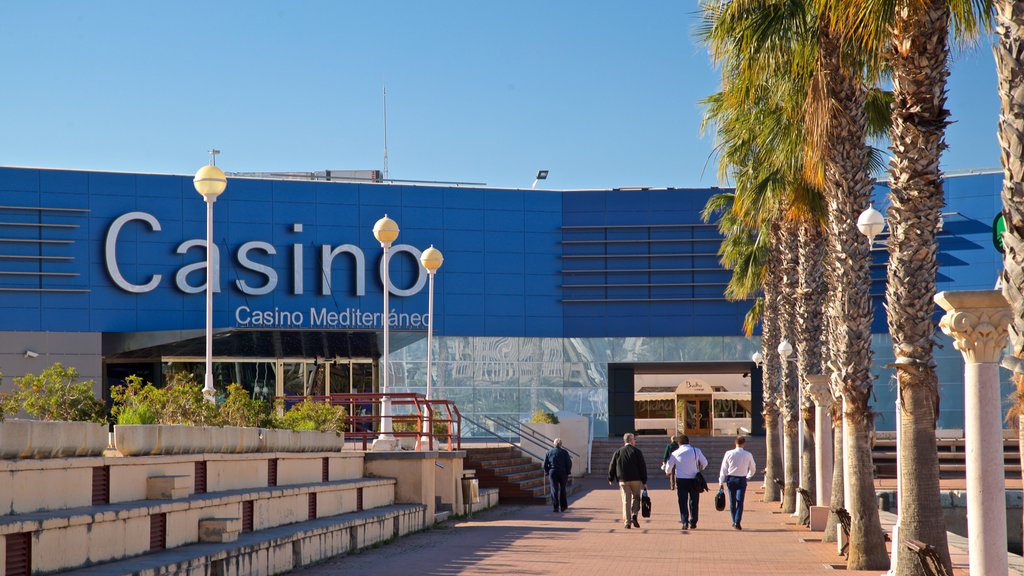 Casino Mediterraneo showing signage as well as a small group of people