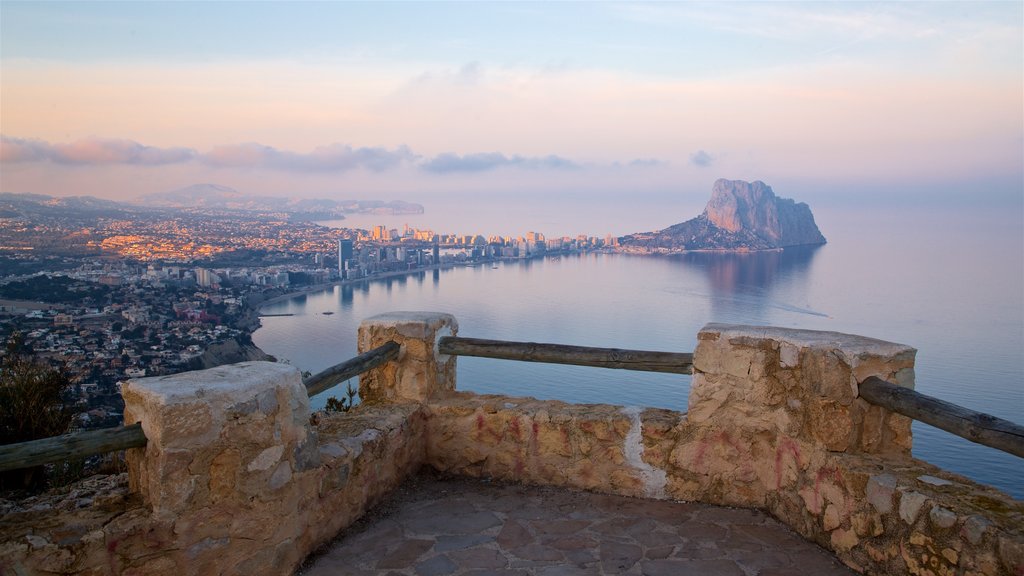 Mirador Monte Toix which includes island views, a sunset and mist or fog