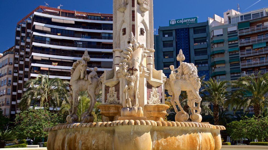 Placa de los Luceros featuring a fountain, a garden and heritage elements