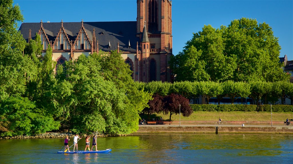 Frankfurt showing a river or creek and kayaking or canoeing as well as a small group of people