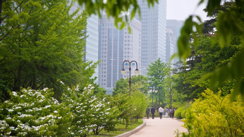 Yeouido Park showing a garden, a city and wildflowers