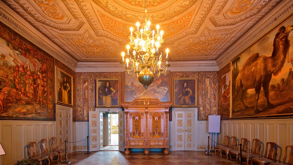 Drottningholm Palace featuring art, interior views and heritage elements