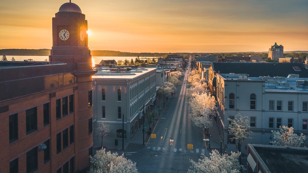 Traverse City showing a sunset, a city and landscape views