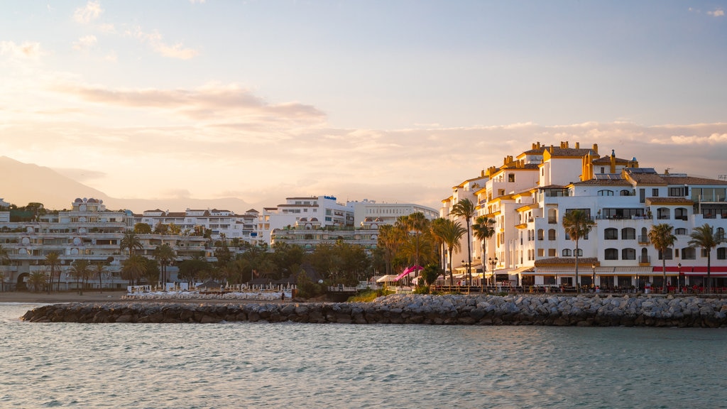 Puerto Banus Marina showing a sunset and a coastal town