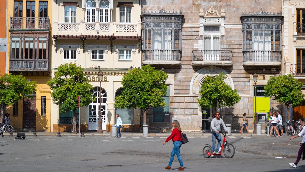 Plaza de San Francisco showing street scenes as well as an individual female