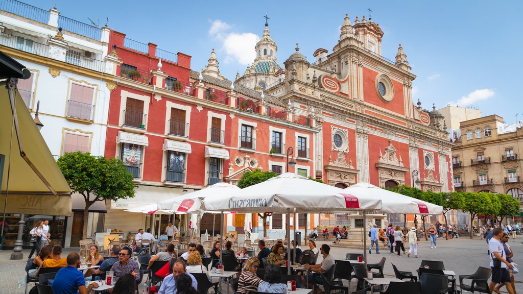 Salvador Plaza showing outdoor eating and heritage architecture as well as a small group of people