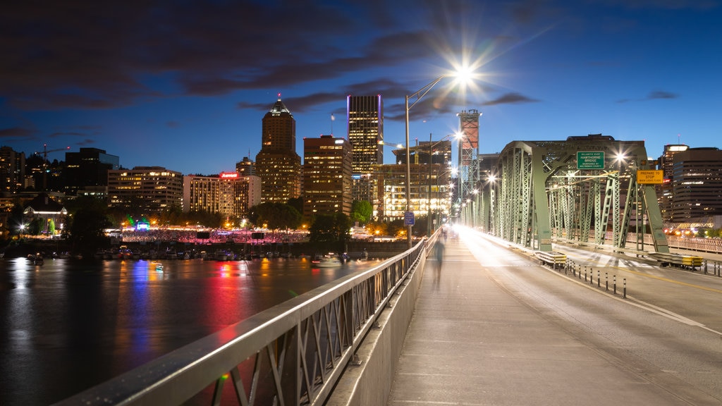 Hawthorne Bridge which includes night scenes, a river or creek and a city