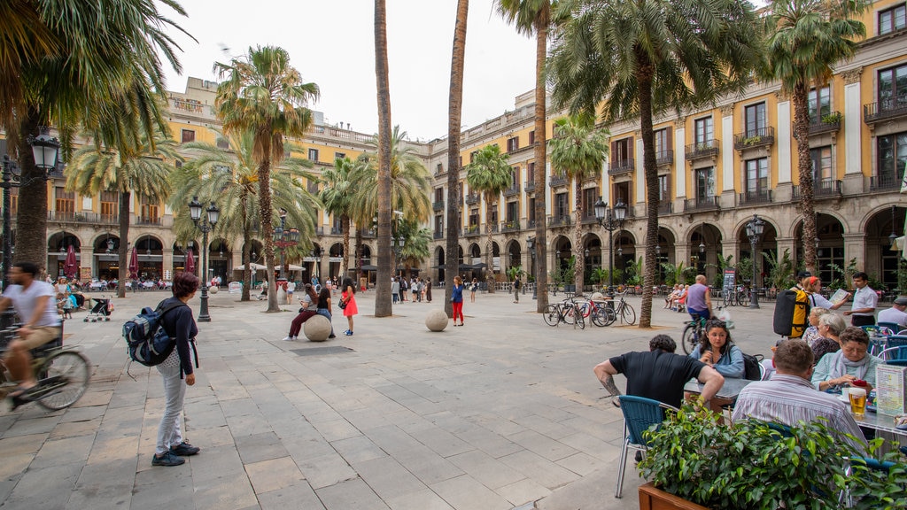 Placa Reial featuring outdoor eating and a square or plaza as well as a small group of people