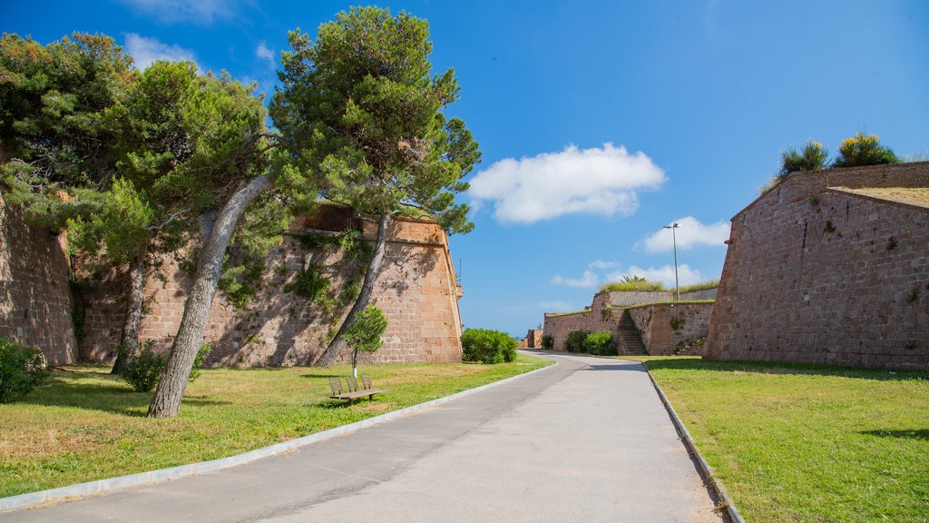 Montjuic Castle featuring heritage elements and a garden