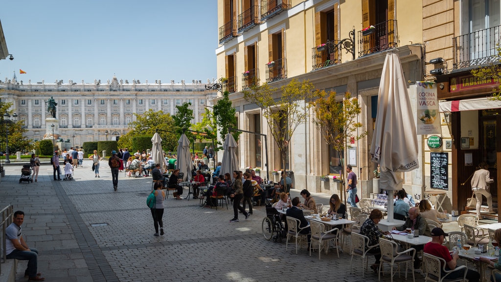 Plaza de Oriente featuring outdoor eating as well as a small group of people