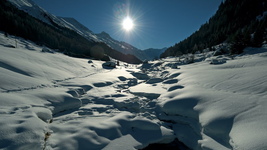 Davos which includes a sunset, tranquil scenes and snow