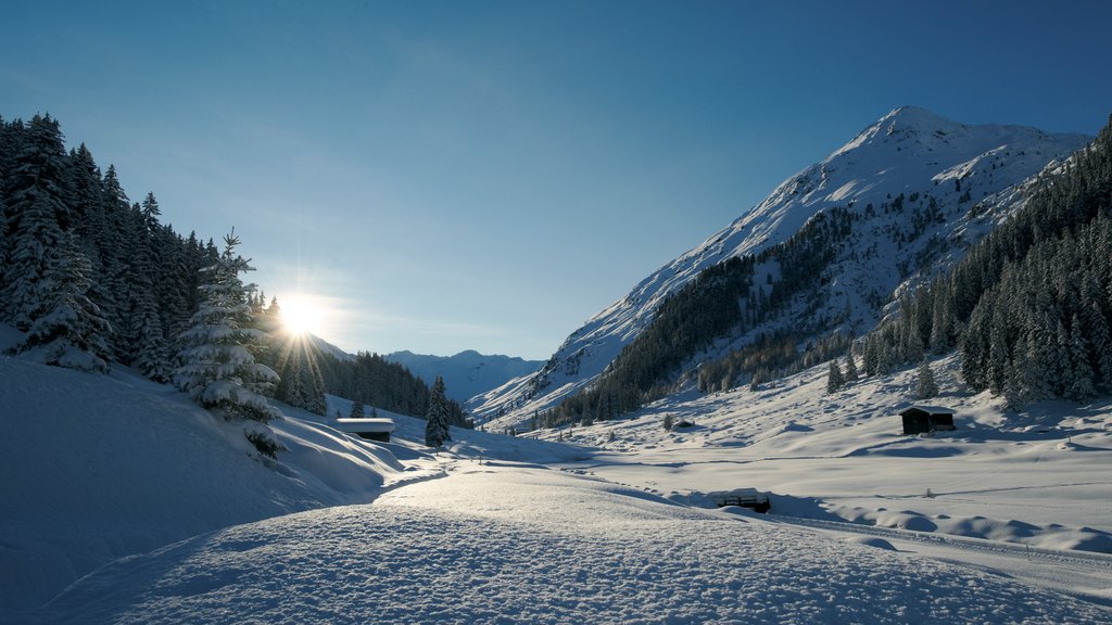 Davos showing a sunset, snow and tranquil scenes