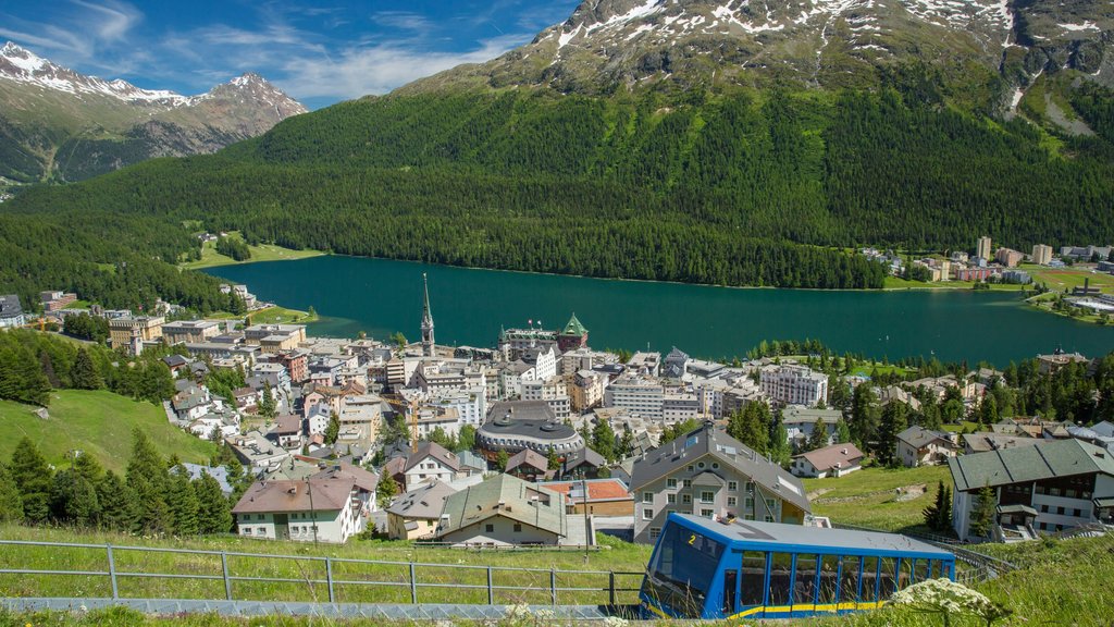 St. Moritz which includes landscape views, a small town or village and a lake or waterhole