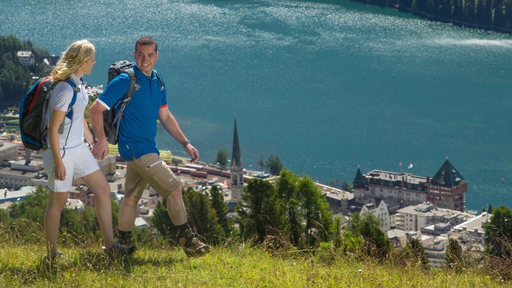 St. Moritz showing hiking or walking as well as a couple