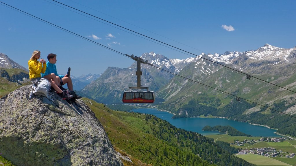 St. Moritz which includes a gondola, a lake or waterhole and hiking or walking