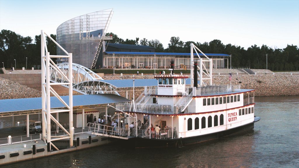 Tunica showing a coastal town and a ferry