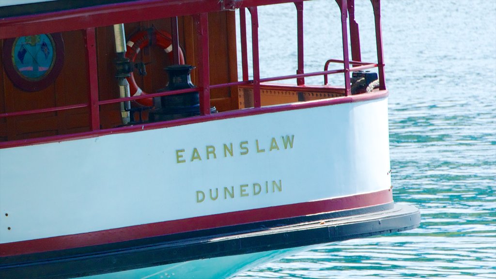 TSS Earnslaw Steamship showing signage and a ferry