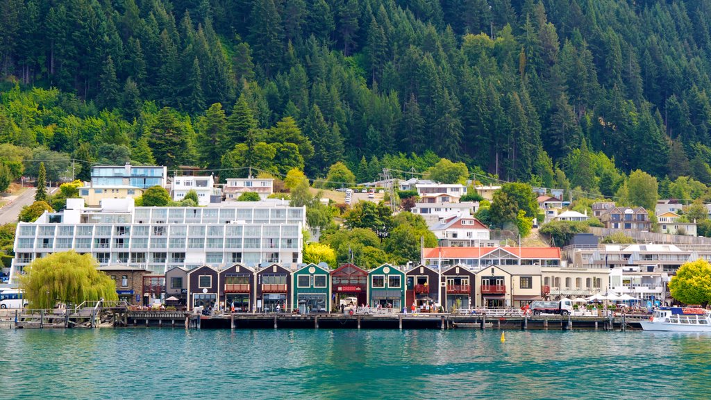 Steamer Wharf showing forest scenes, a bay or harbor and a coastal town