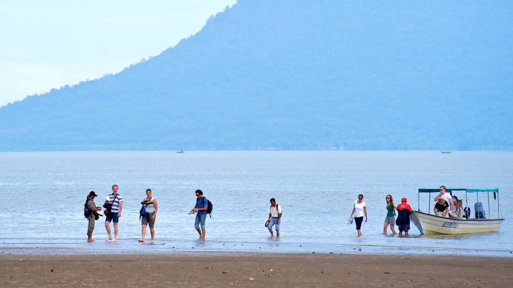 Bako National Park featuring boating, a sandy beach and tropical scenes