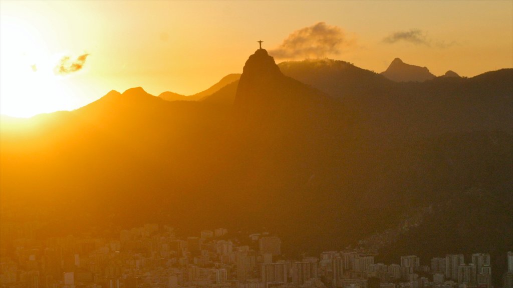 Sugar Loaf Mountain which includes a sunset, a city and mountains