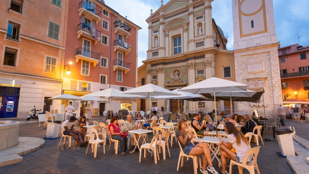 French Riviera featuring a city and outdoor eating as well as a small group of people