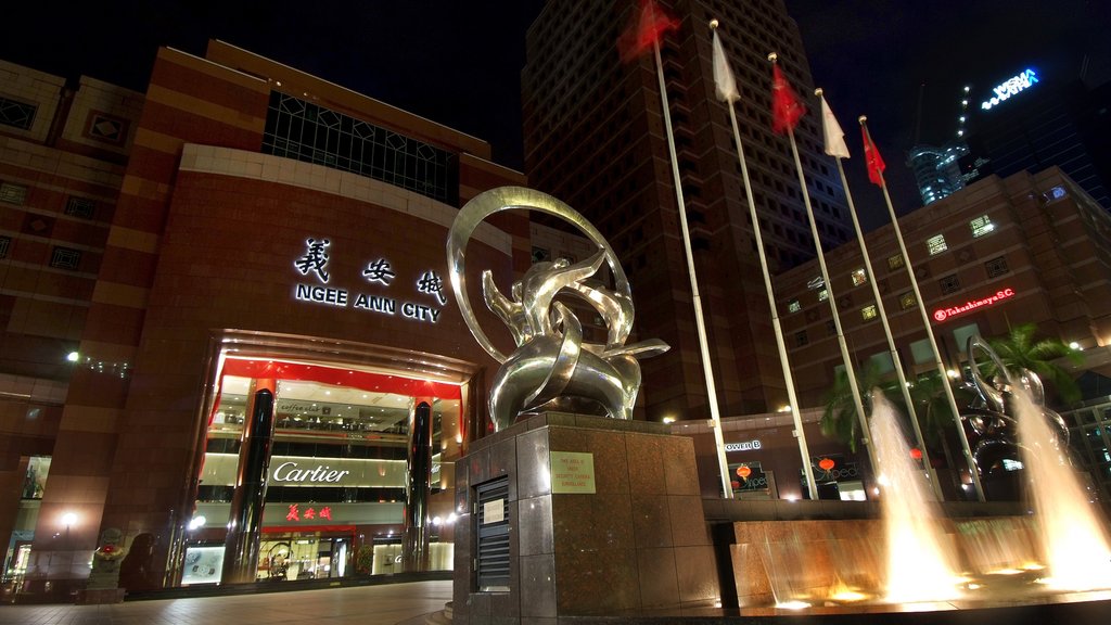 Orchard Road which includes outdoor art, a fountain and a city