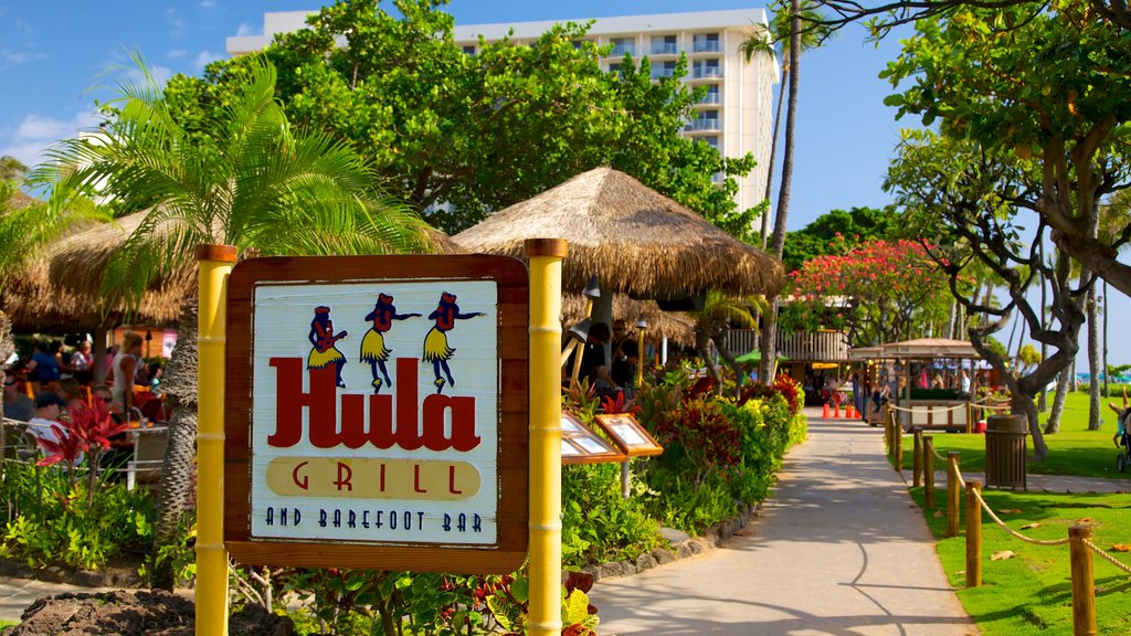 Kaanapali Beach showing tropical scenes, signage and outdoor eating