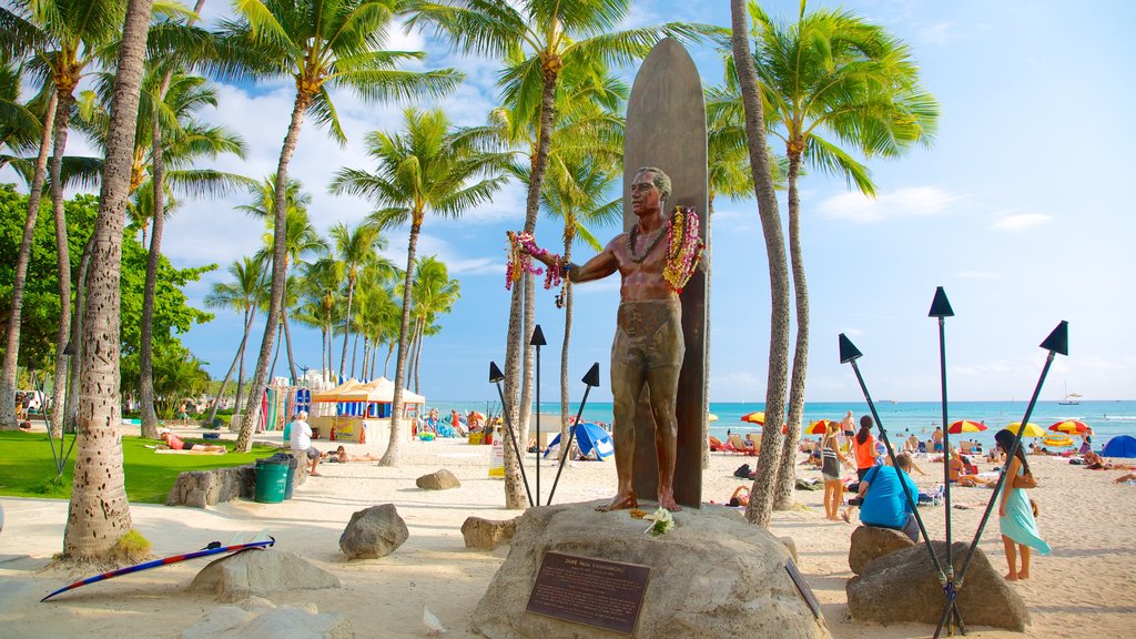 Waikiki Beach featuring tropical scenes, a sandy beach and a monument