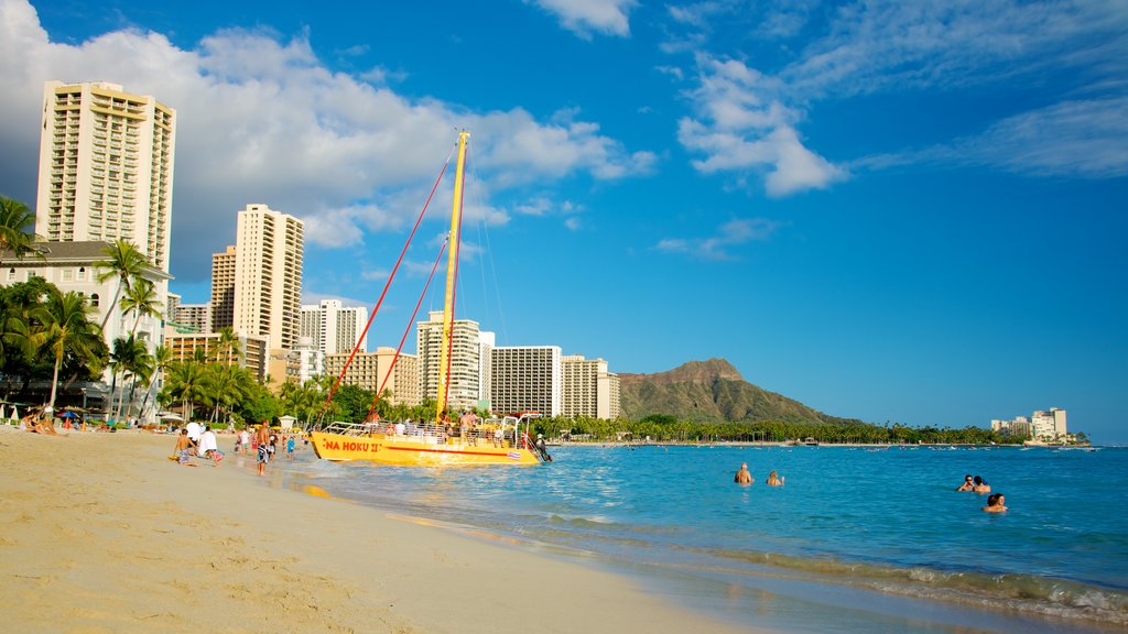 Waikiki Beach welches beinhaltet Schwimmen, Sandstrand und allgemeine Küstenansicht