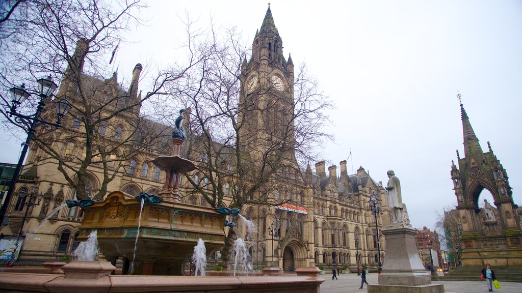 Albert Square which includes a church or cathedral, a square or plaza and a city