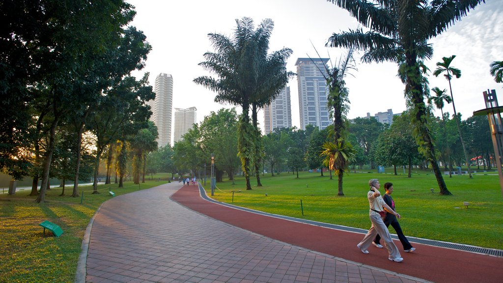 Petronas Twin Towers which includes a high rise building, a park and a city