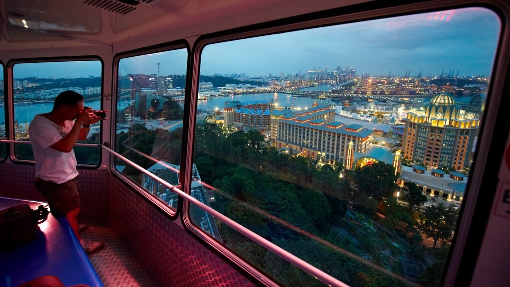 Ilha de Sentosa mostrando uma cidade, arquitetura moderna e cenas noturnas