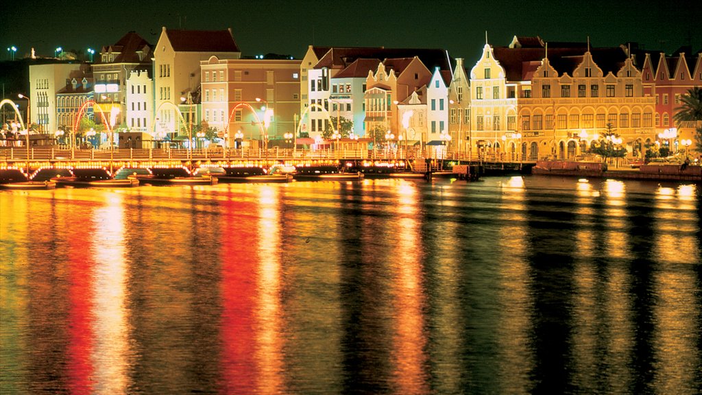 Willemstad showing night scenes, a coastal town and heritage architecture