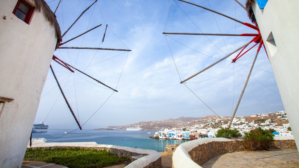 Windmills of Mykonos showing a coastal town, a windmill and a bay or harbour