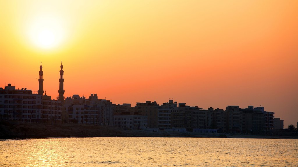 Cairo showing a coastal town, a sunset and general coastal views