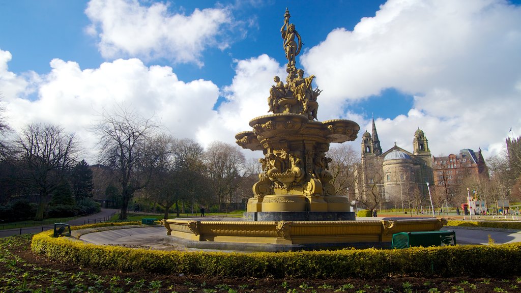 Princes Street-tuinen toont een standbeeld of beeldhouwwerk en een fontein