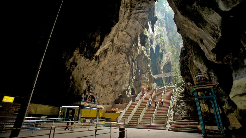 Batu Caves featuring landscape views, caving and interior views