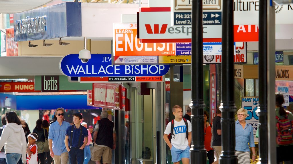 Queen Street Mall featuring signage, street scenes and a city