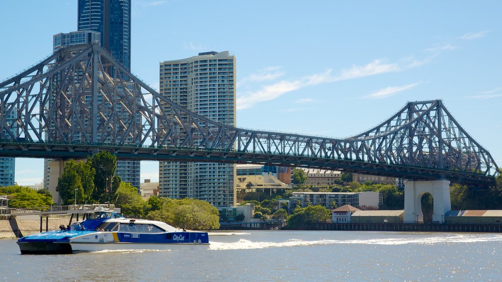 Story Bridge which includes a skyscraper, boating and cbd