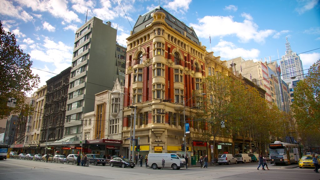 Collins Street showing heritage architecture, street scenes and a city