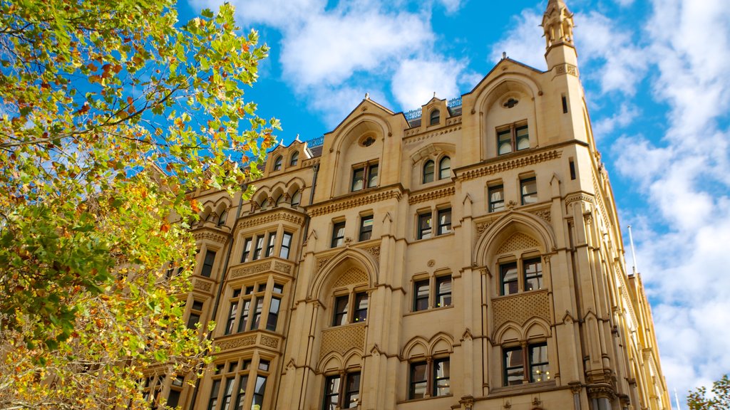 Collins Street featuring a city, heritage architecture and street scenes