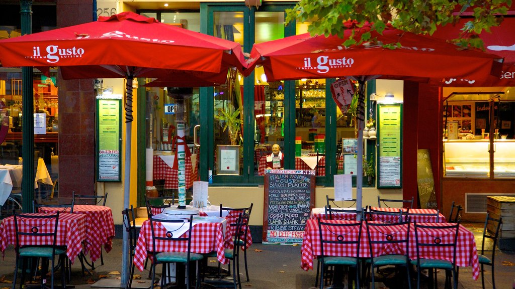 Lygon Street showing outdoor eating, a city and signage