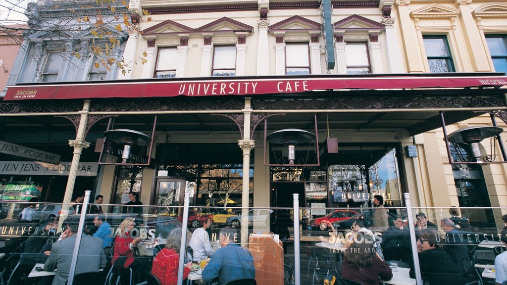 Lygon Street featuring outdoor eating, a city and signage