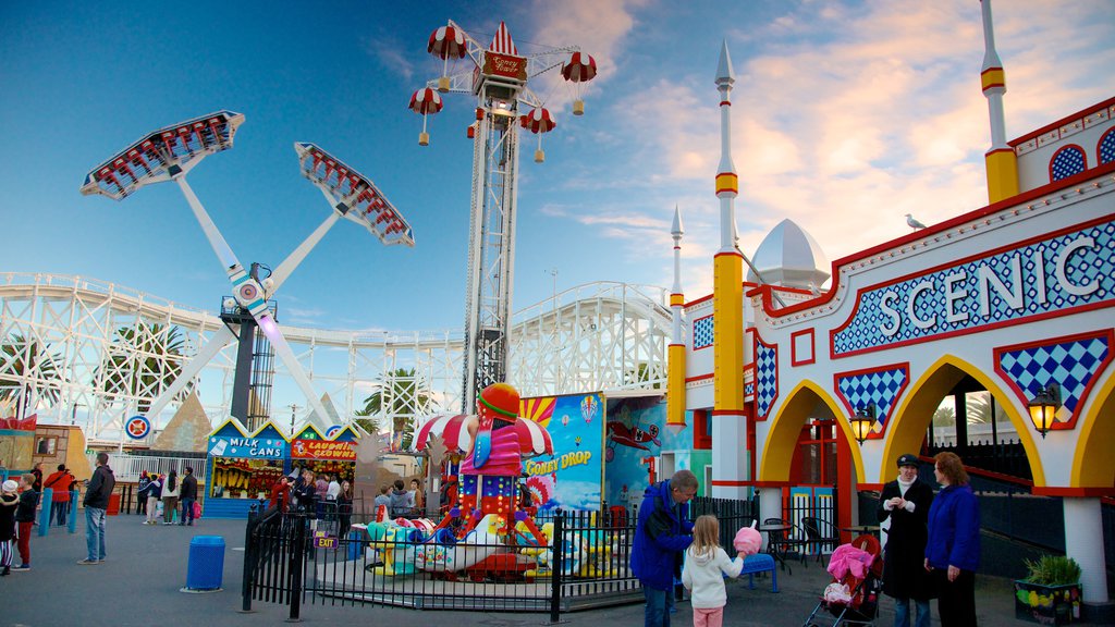 Luna Park featuring rides as well as a family